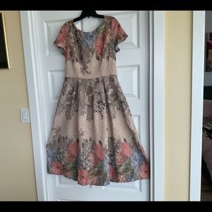 Adriana Papell designed midi length dress.